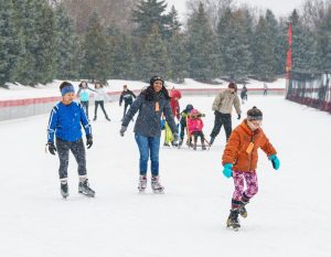 People skating at the Oval outdoor ice rink in Roseville